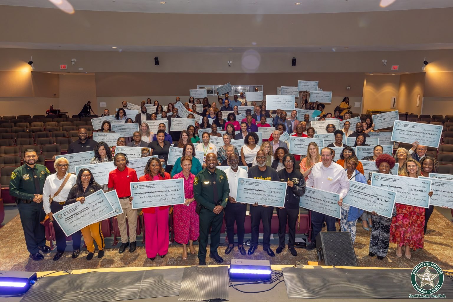 LETF grant recipients holding their award checks