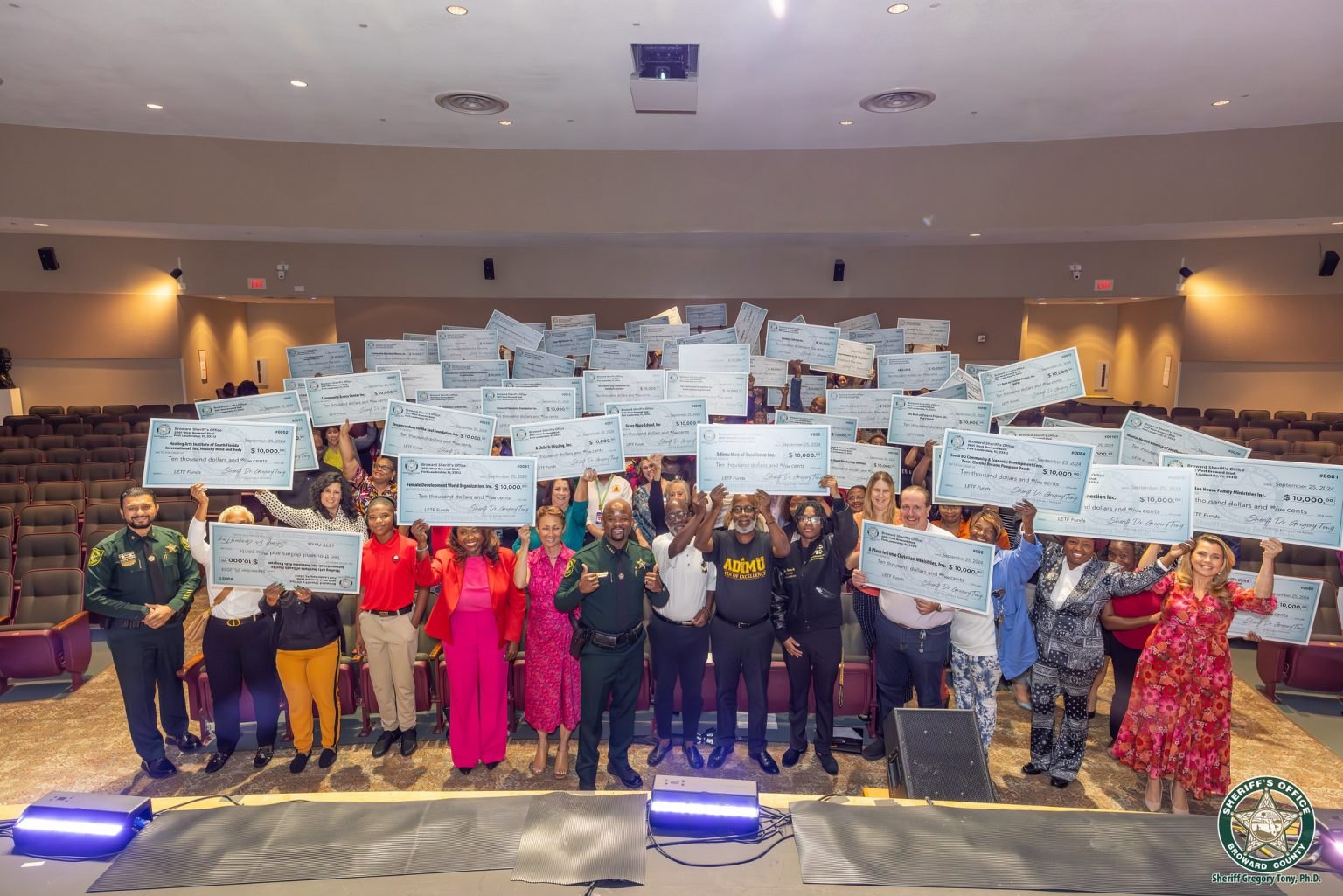 Broward Sheriff's Office LETF grant recipients on stage with Sheriff Gregory Tony