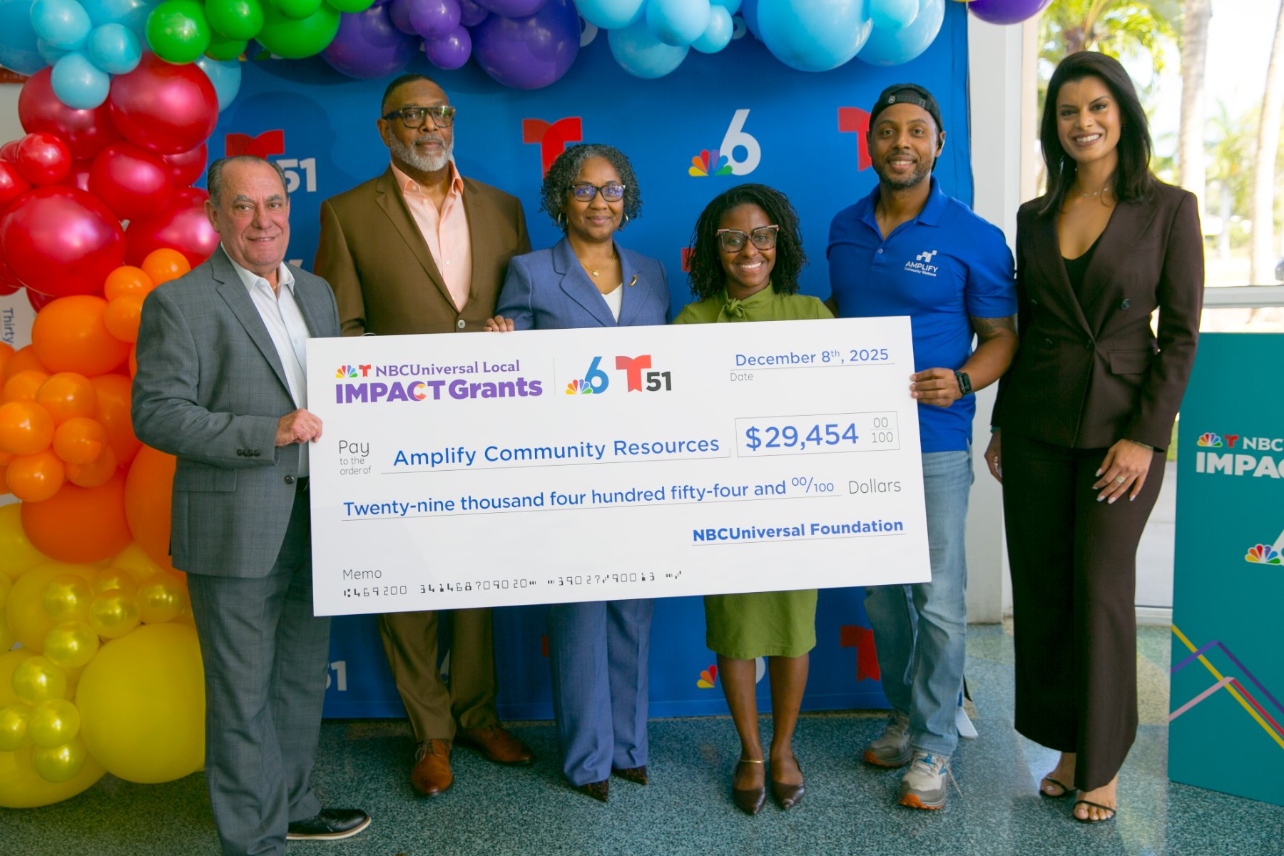 ACR team receiving the NBCUniversal Local Impact Grant check for $29,454 from the NBCUniversal Foundation, December 8, 2025